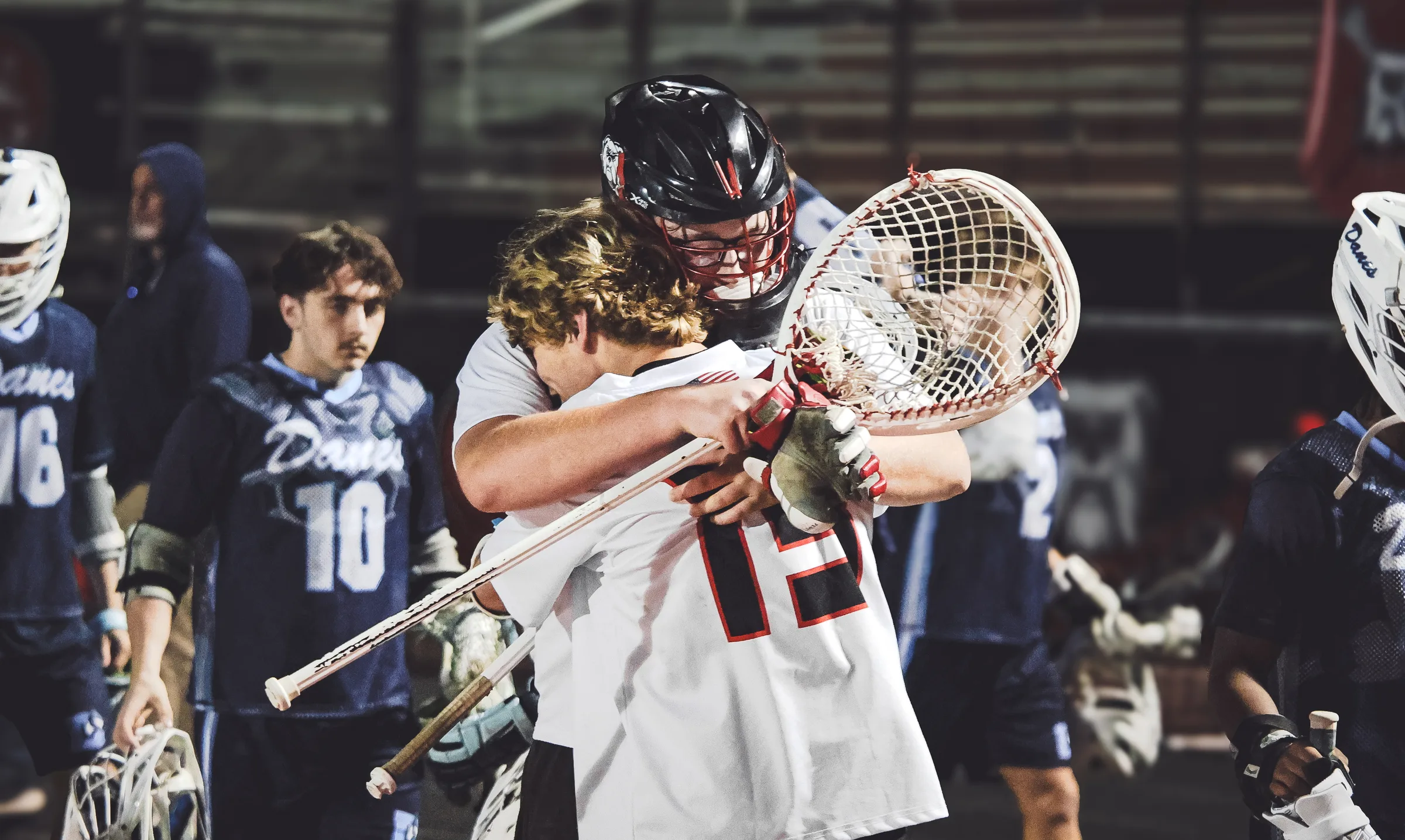 North Gwinnett boys lacrosse players celebrating after a play