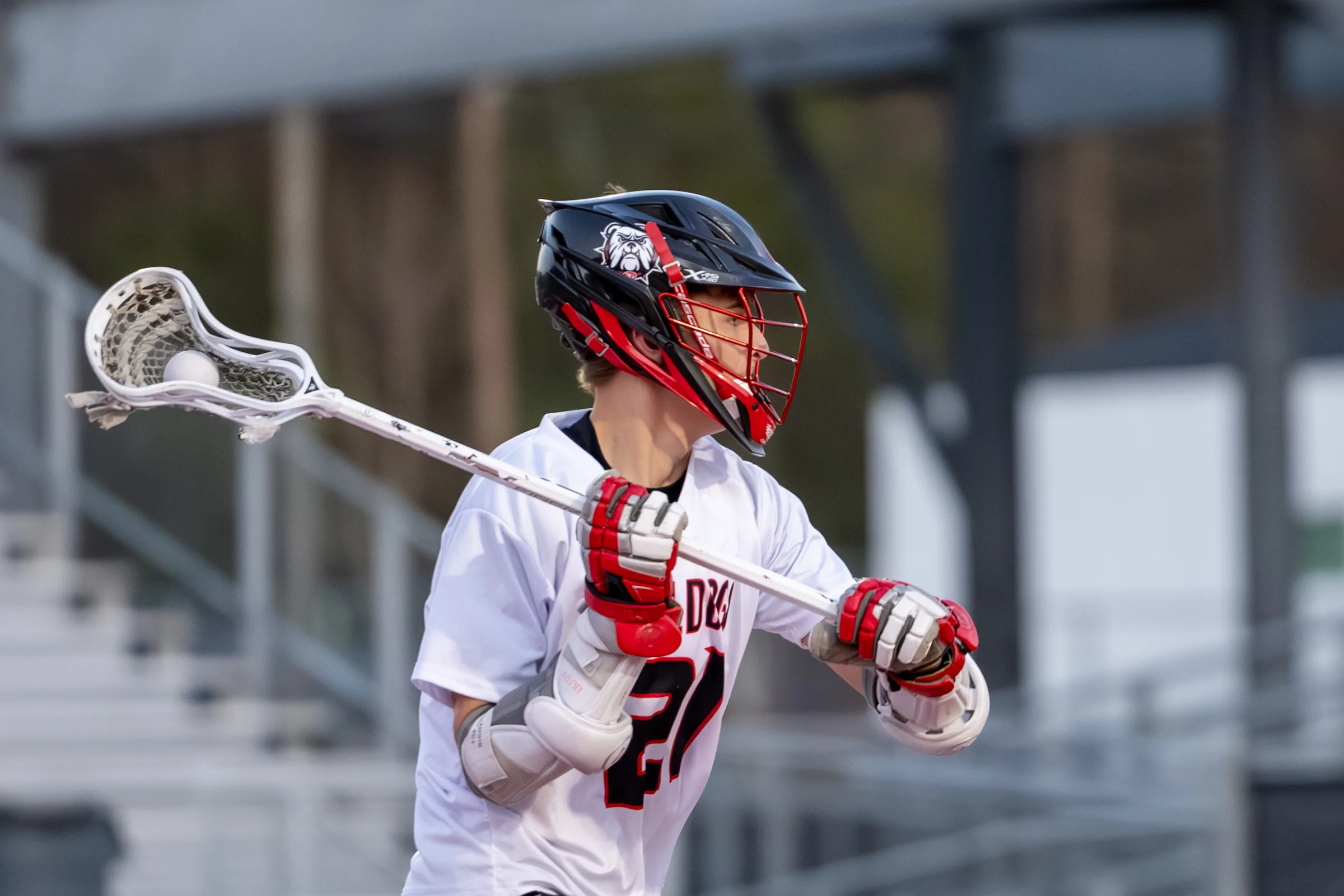 Boys lacrosse player carrying the ball at North Gwinnett