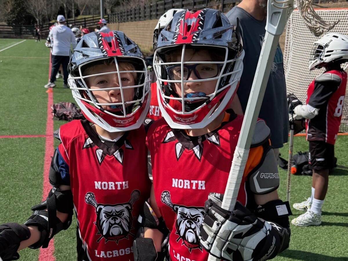 Winn family lacrosse players on the field